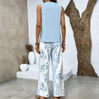Women's Sleeveless Top and Wide-Leg Trousers Set with Layered Hem Top and Leaf Print Trousers