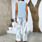 Women's Sleeveless Top and Wide-Leg Trousers Set with Layered Hem Top and Leaf Print Trousers