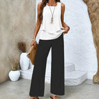 Women's Sleeveless Top and Wide-Leg Trousers Set with Layered Hem Top and Leaf Print Trousers